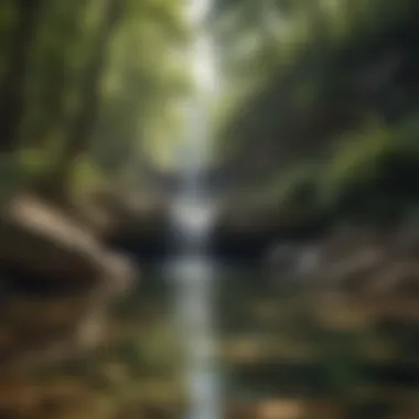 A tranquil pool formed at the base of a stunning waterfall reflecting the surrounding landscape.