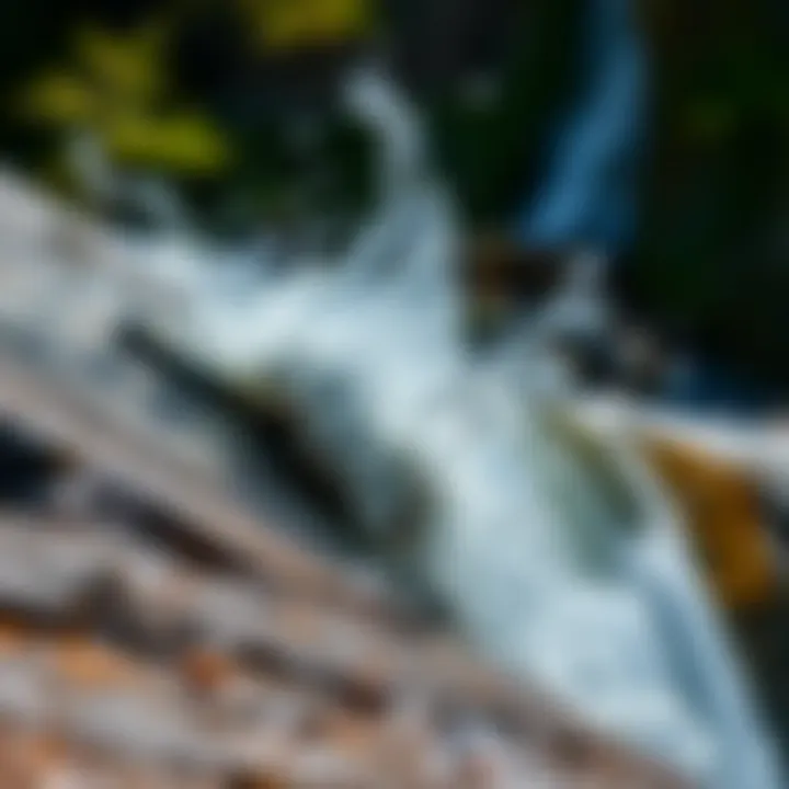A close-up view of water splashing against a rocky surface, showcasing the power of nature.