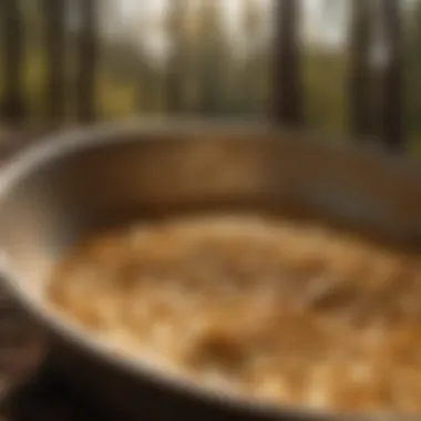 Close-up of gold flakes shimmering in a pan under sunlight.